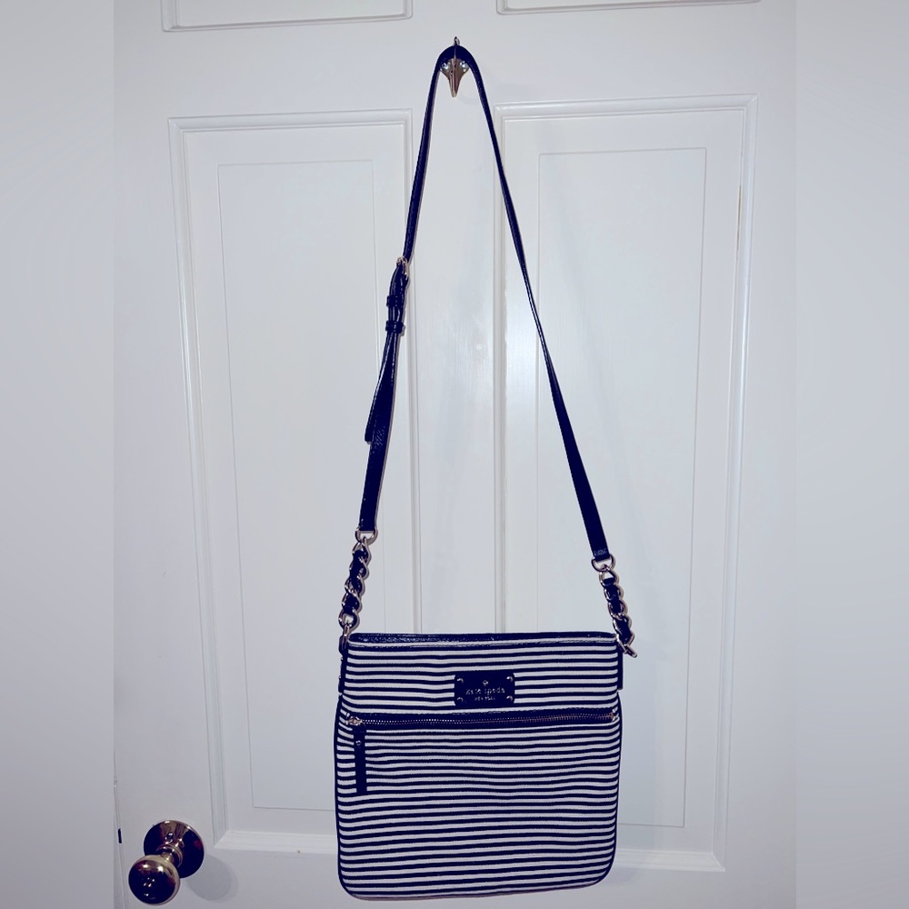 Kate Spade adjustable strap cross body. Black and white stripe. Never worn.